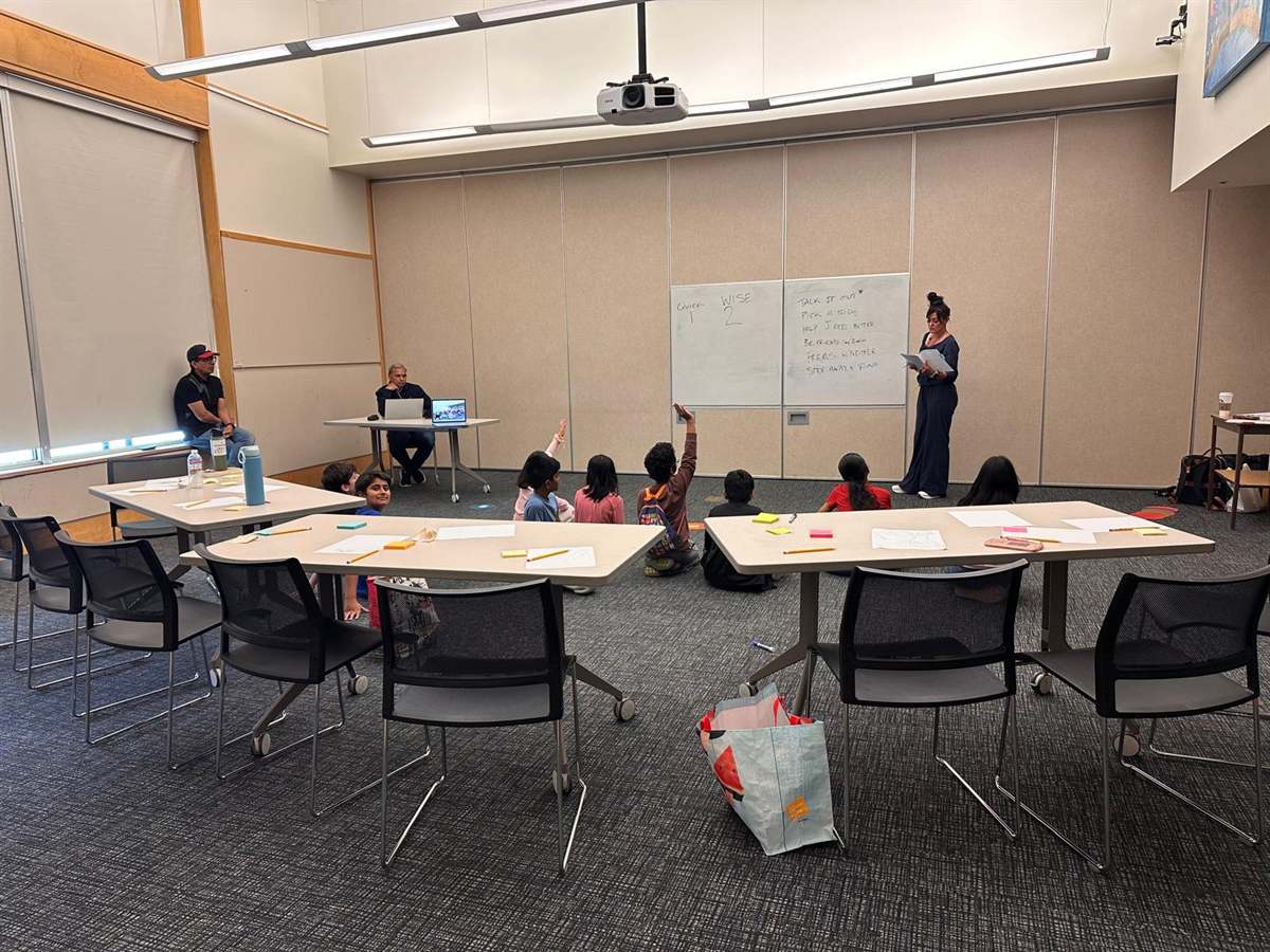 Children mapping options on the whiteboard at The Situation Room